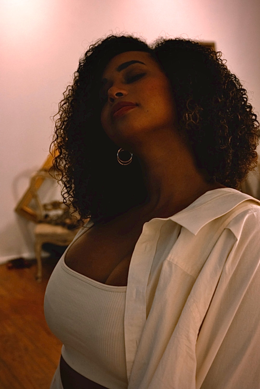 Moody editorial portrait in amber light by Story By Blank
